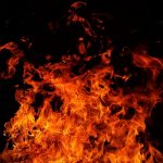 red fire flames on black background