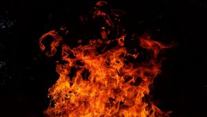 red fire flames on black background